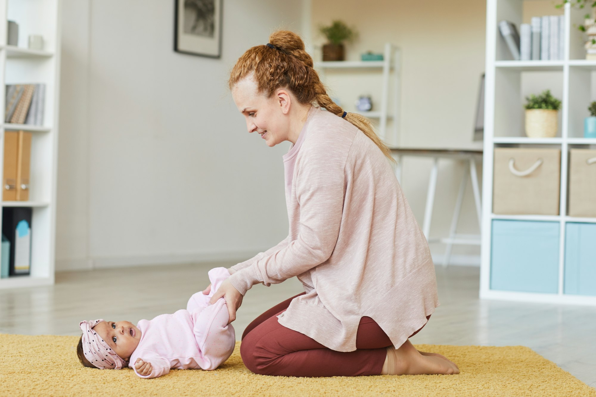 Woman exercising with baby